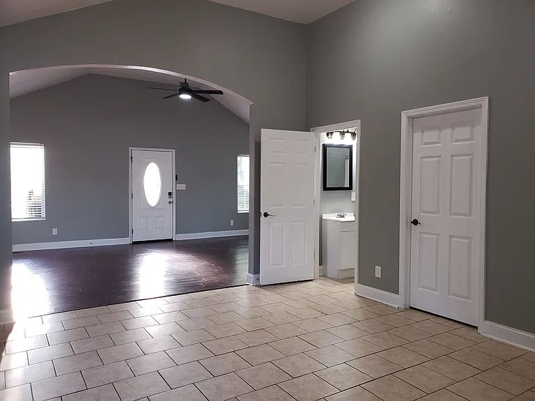 Kitchen and Living Room with full bath and laundry room on the right 2026