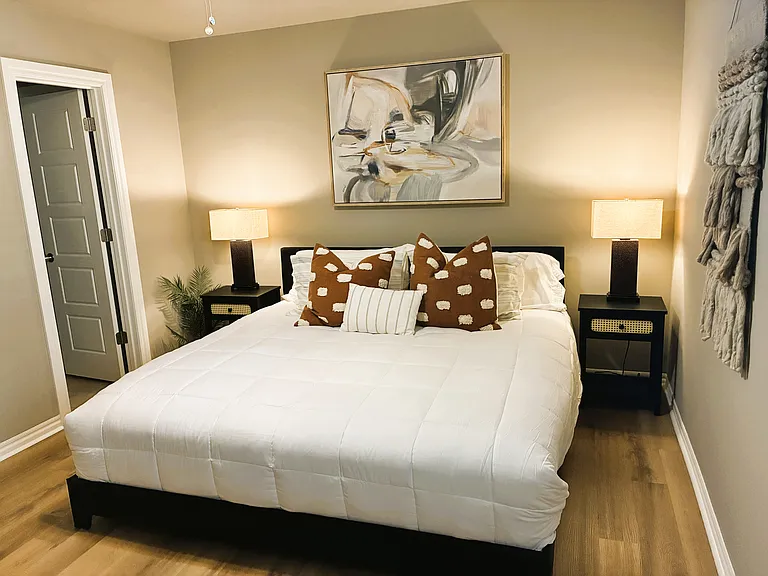Master King bed downstairs. Mattress topper for extra comfort.