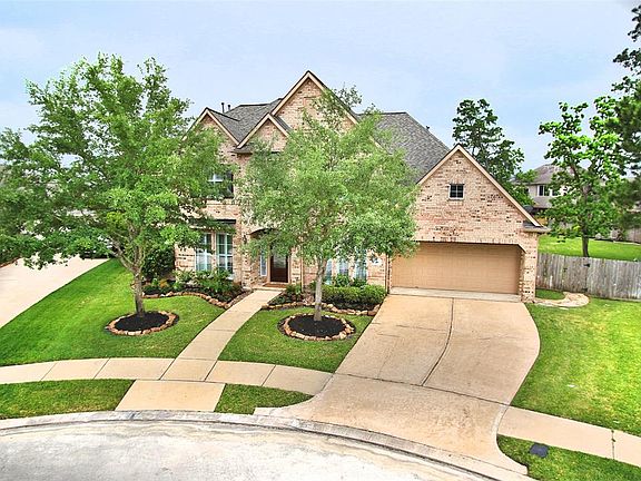 Professional landscape surrounds this 17,631 sf cul-de-sac lot both front and back. Roof 2016.