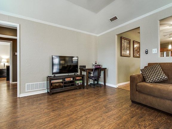 Large living room with desk for working.