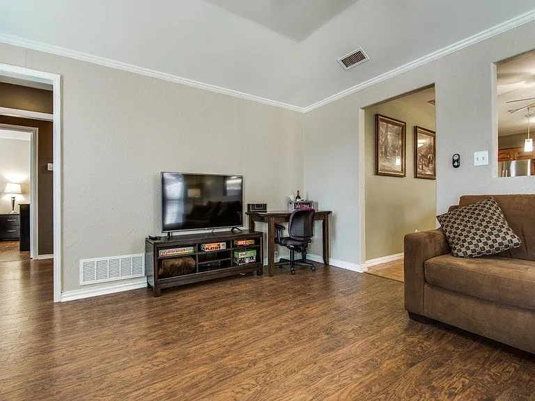 Large living room with desk for working.
