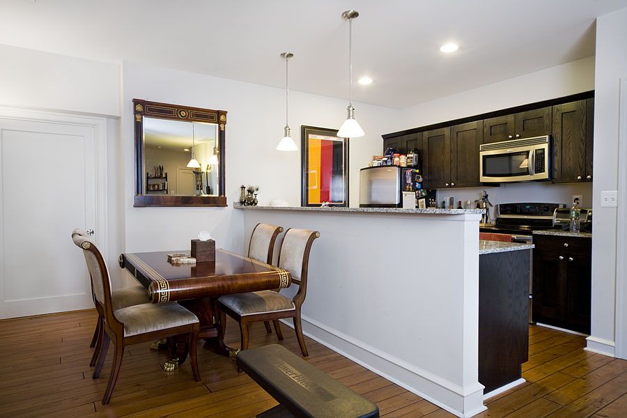 Spacious units offer numerous amenities, such as hardwood flooring, stainless steel appliances, and granite countertops