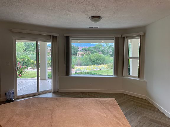 Kitchen table area with beautiful view of mountains and back yard/hole #2 on Black Rock course.