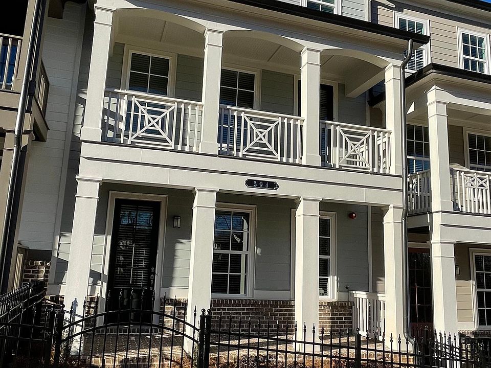 Craftsmen style 2 year-old townhome by Stanley Martin has private courtyard & includes 2 covered porches plus a deck off the family room.