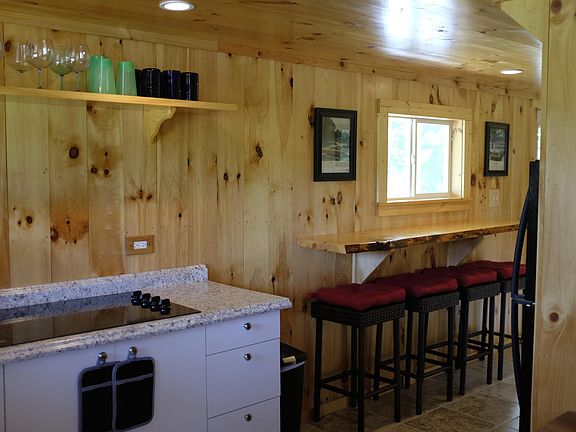 Kitchen cooktop and counter. Counter now has two chairs with backs so you can work on your laptops while gazing out to the view.