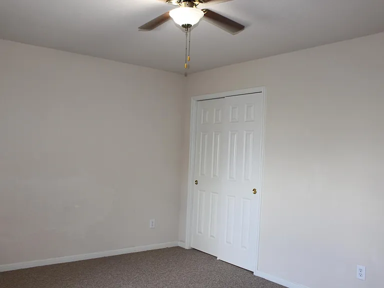 upstairs bedroom with walking in closet