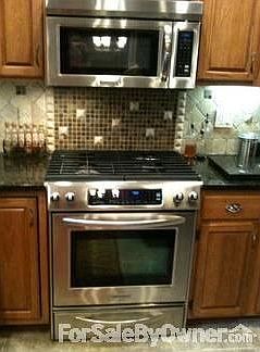 Kitchenaid appliances
						:
						Gas stove with warmer and desirable freezer on bottom refrigerator.