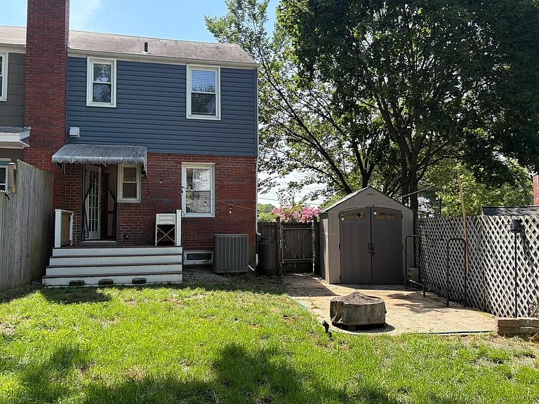Backyard with fire pit and storage shed