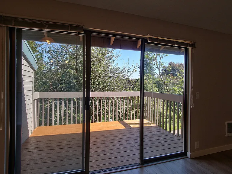Large triple window slider onto the private deck w/storage