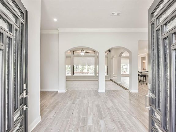 The elegant entry is enhanced with decorative Double Glass Metal door and Tile- wood floors allows entry into an amazing and elegant floor plan!