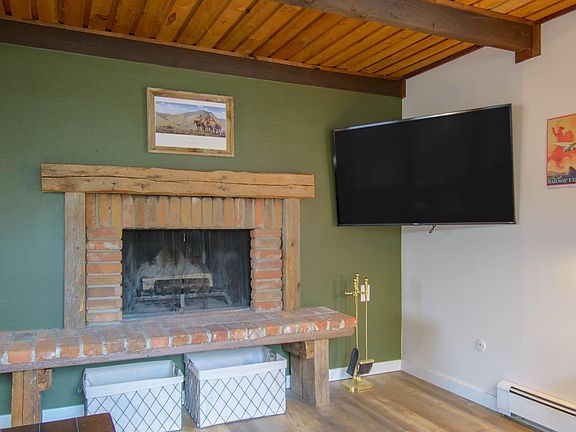 Working fireplace for a warm winter evening and 55" Television.