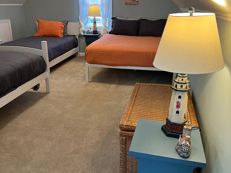 Upstairs bedroom, very spacious, one queen bed and two twin beds.