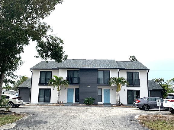 Front View of 4 Unit Building. New Roof, Impact Windows & Doors, Paint.