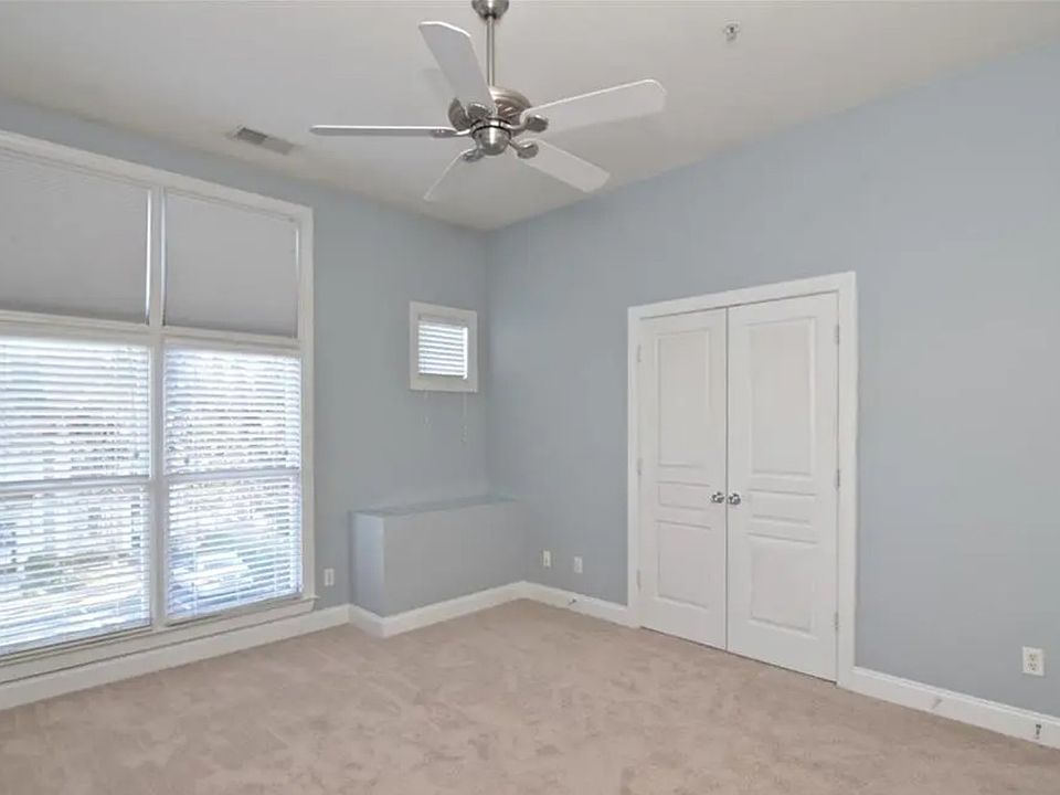 Primary bedroom with beautiful tall ceilings, excellent natural light, and large walk in closet