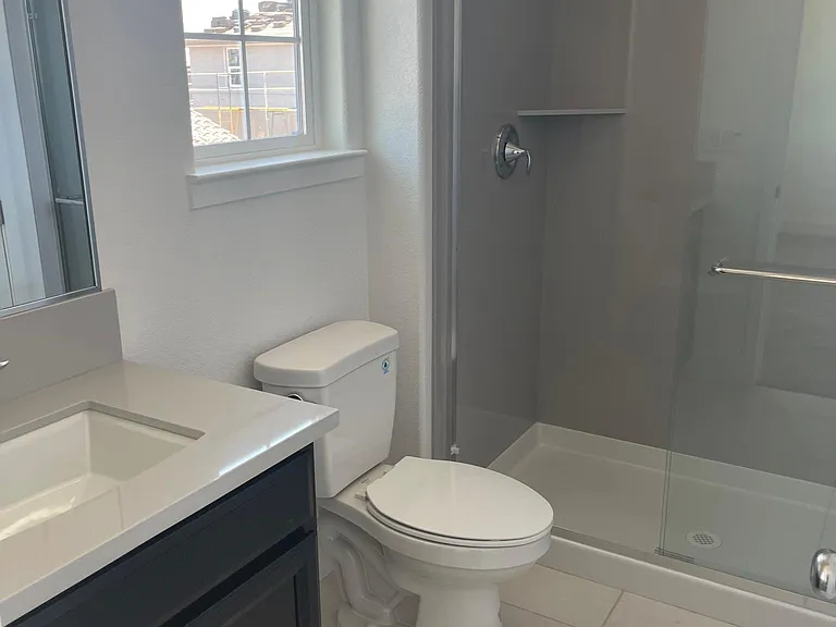 Full bathroom with walk in closet