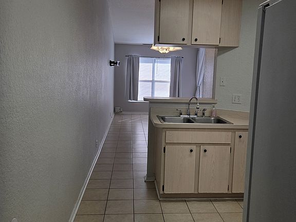 Hallway to kitchen, dining and family room