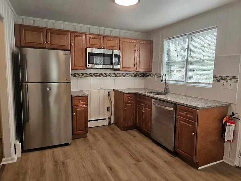 Kitchen 1 - Refrigerator, microwave, dishwasher, and stove (not yet installed)