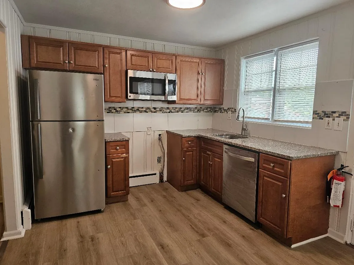 Kitchen 1 - Refrigerator, microwave, dishwasher, and stove (not yet installed) - 1656 Pennington Rd