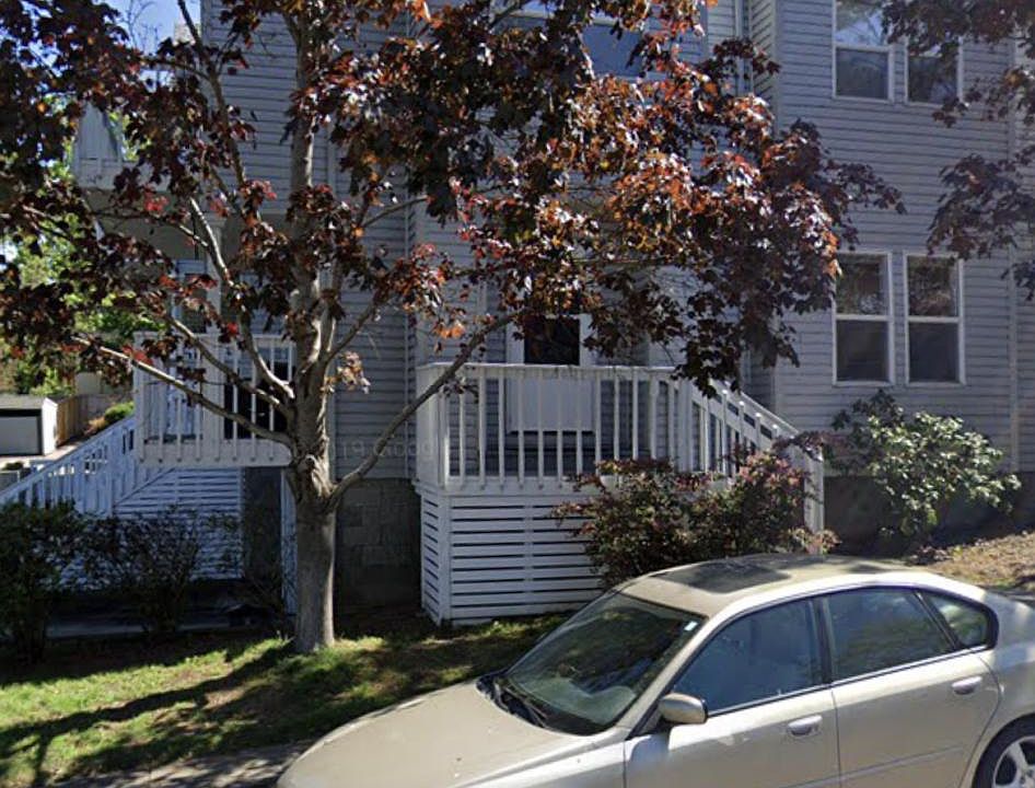 From the street. Side of condo. Entry door here and rear gated patio.