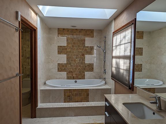Master bathroom suite with walking closet and separate bathroom & additional closet
