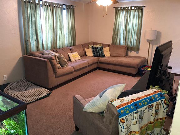 Living room after tenant decorated, looking from hallway.