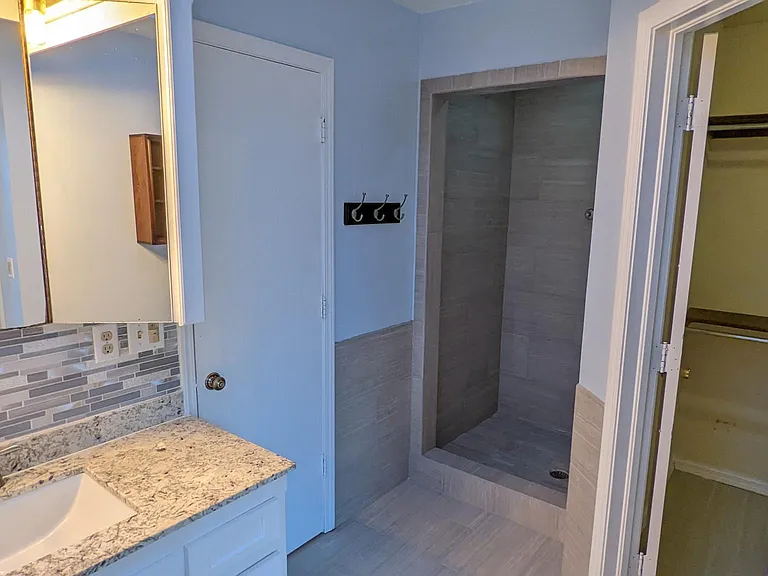 Separate walk-in shower and bathtub/shower. The home comes with a recirculation pump for instant hot, water!