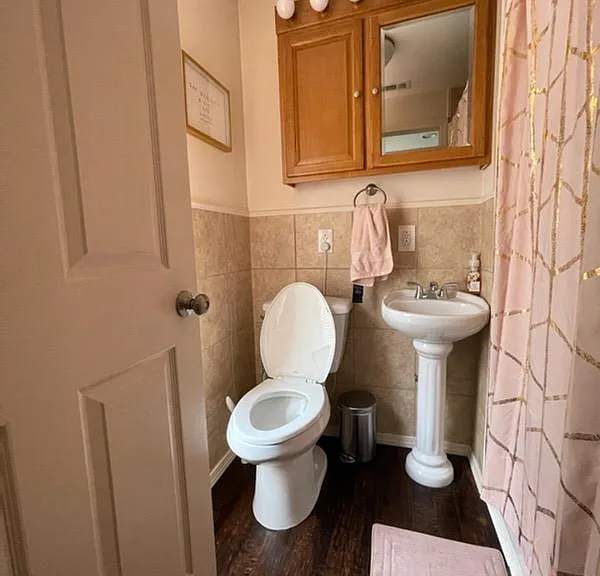 Bathroom with half tiled walls