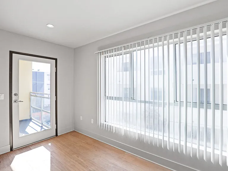 Living Room Area with Large Windows and Patio