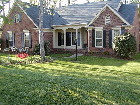 Beautiful all brick ranch. SideGarage,fenced,screen porch,deck,wood floors.