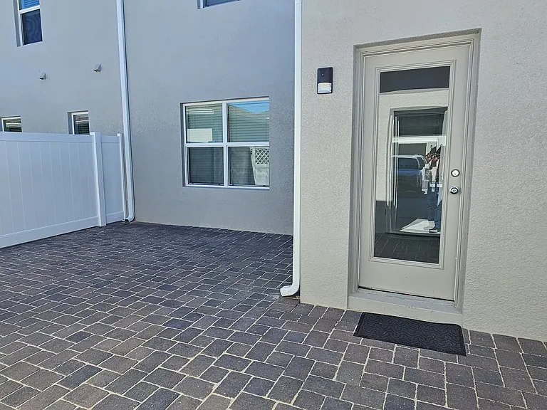 Spacious Courtyard with privacy fence on both sides.
