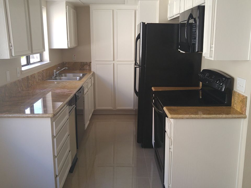 clean kitchen with granite counters