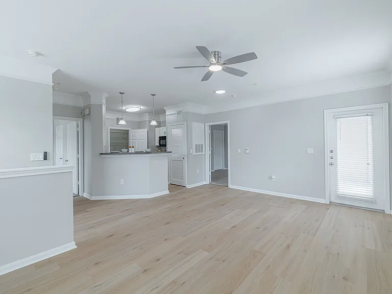 Open concept kitchen and living room with hardwood flooring