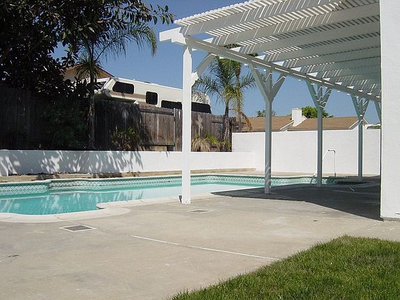 Side yard has grass, great pool with spa!