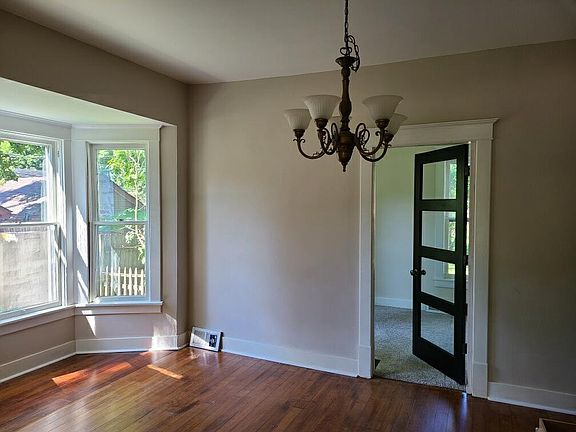 Dining room looking toward den/office (glass door).