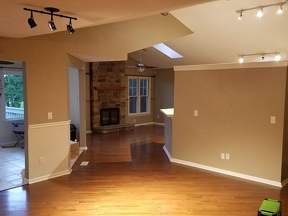 Dining room, living room, sunroom. Note the skylights.