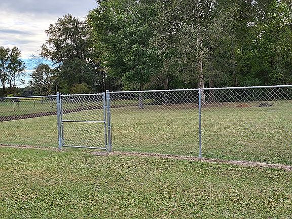 partially fenced back yard
