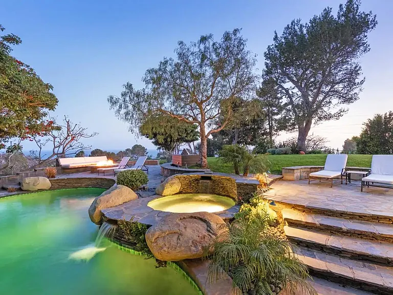 Pool, Jacuzzi, Fireplace accompanied by plush loungers.