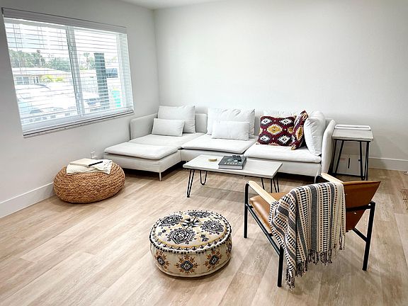 Living room comes fully furnished with large couch and new wall mounted big screen smart TV. Has cordless blinds and tons of natural light.