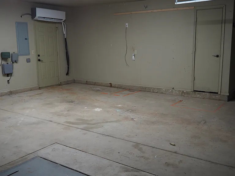 garage with in-ground storm cellar