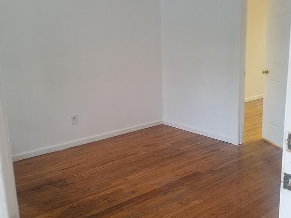 living room with door to dining