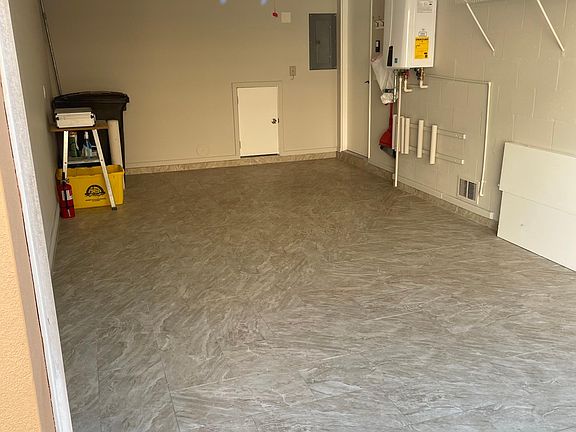 Garage with tile floor.