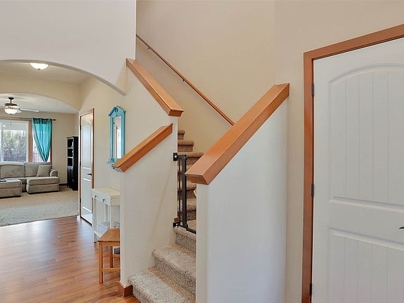 Entrance to the home opens to views of the arched entry into the main living area.>