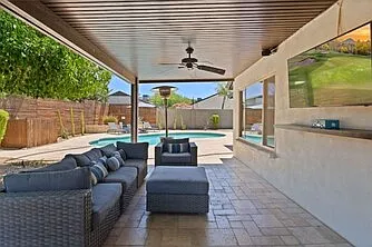 Patio space off of master bedroom with outdoor TV