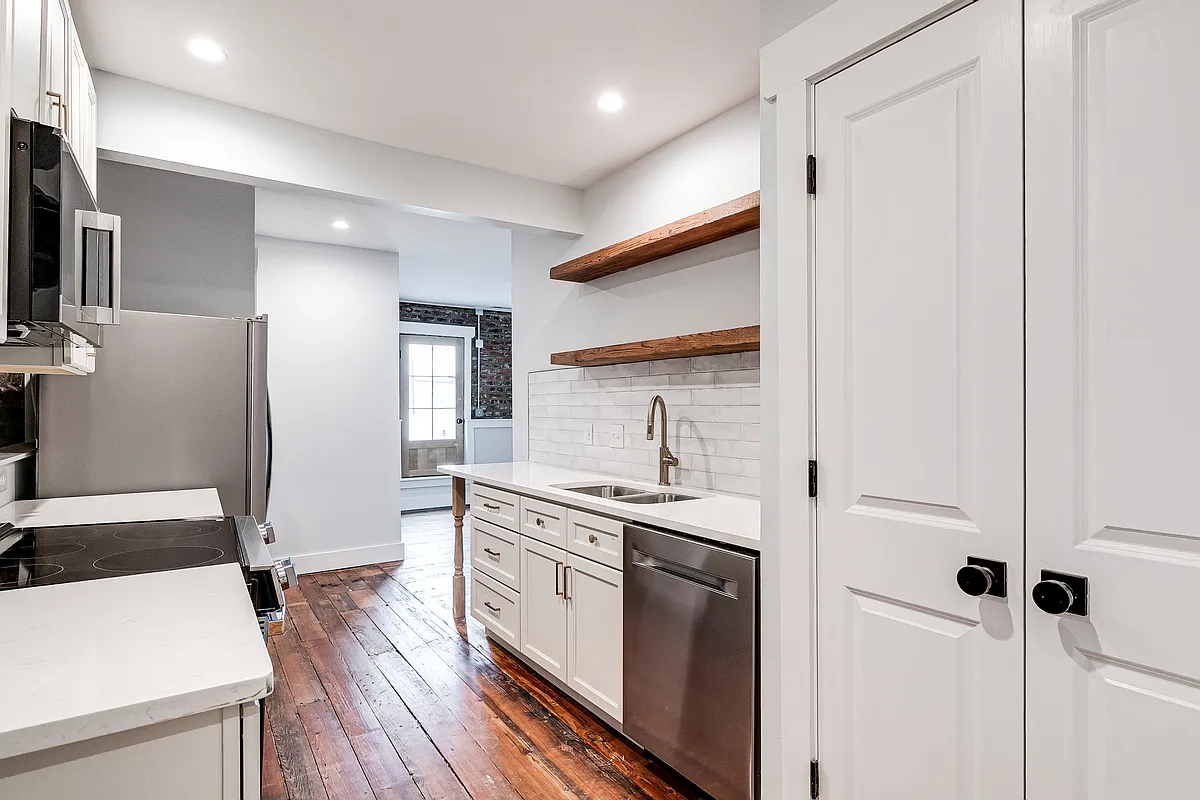 Enter the apartment into the galley kitchen. The large pantry is to the right of the dishwasher seen in this view. - 2400 Venable St #201