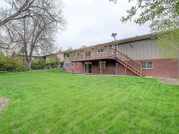 Back deck and yard with plenty of room for a garden.