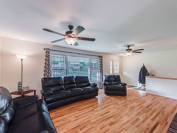 Brand new hardwood floors greet you upon entering, the spacious living room features lots  of natural light pouring in from the home's new windows.  There is nothing to do but move in and enjoy the beautiful space!