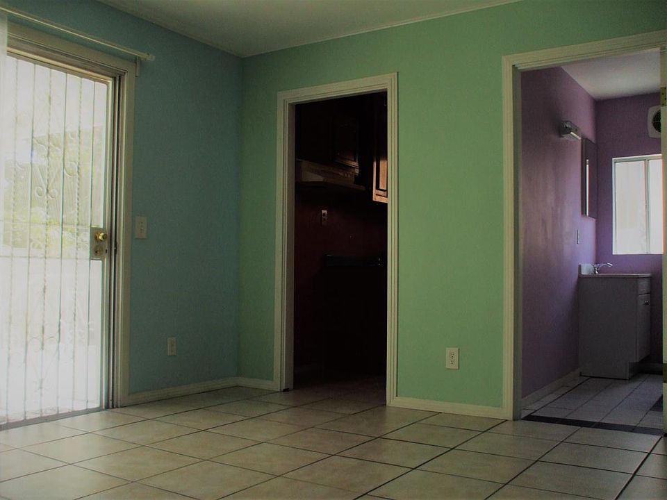 Main Living Area with entrance to Kitchen and Bathroom