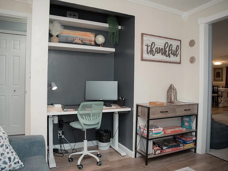Dedicated workspace with a quiet desk nook, ergonomic chair, and plenty of light for remote work.
