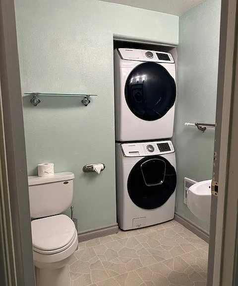 Bathroom with full size washer and dryer.