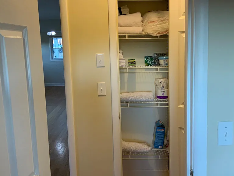 View outside main bathroom to linen closet